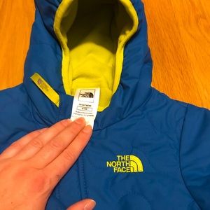 The North Face, baby boy snowsuit with fold over hands & feet. Size 6-12 Months.